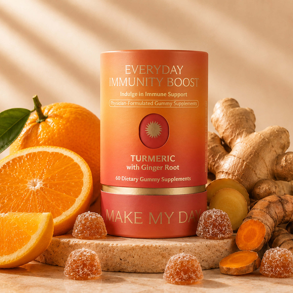 A cylindrical supplement bottle labeled 'EVERYDAY IMMUNITY BOOST' and 'TURMERIC with Ginger Root' stands on a stone slab surrounded by oranges, ginger root, and gummy candies. The bottle is peach-to-pink gradient with gold text and a gold band, set against a warm beige background with soft leaf shadows.