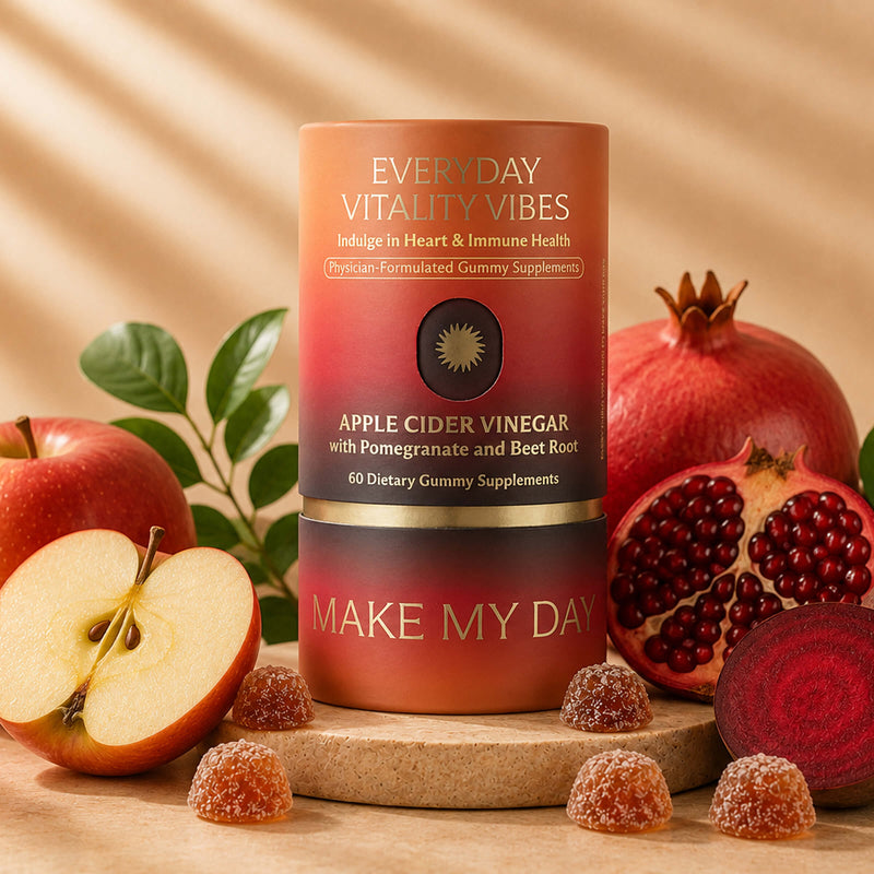 A bottle of Everyday Vitality Vibes Apple Cider Vinegar dietary supplement is styled on a wooden surface with fresh apples, a pomegranate, beet root, and gummy candies against a warm beige background.